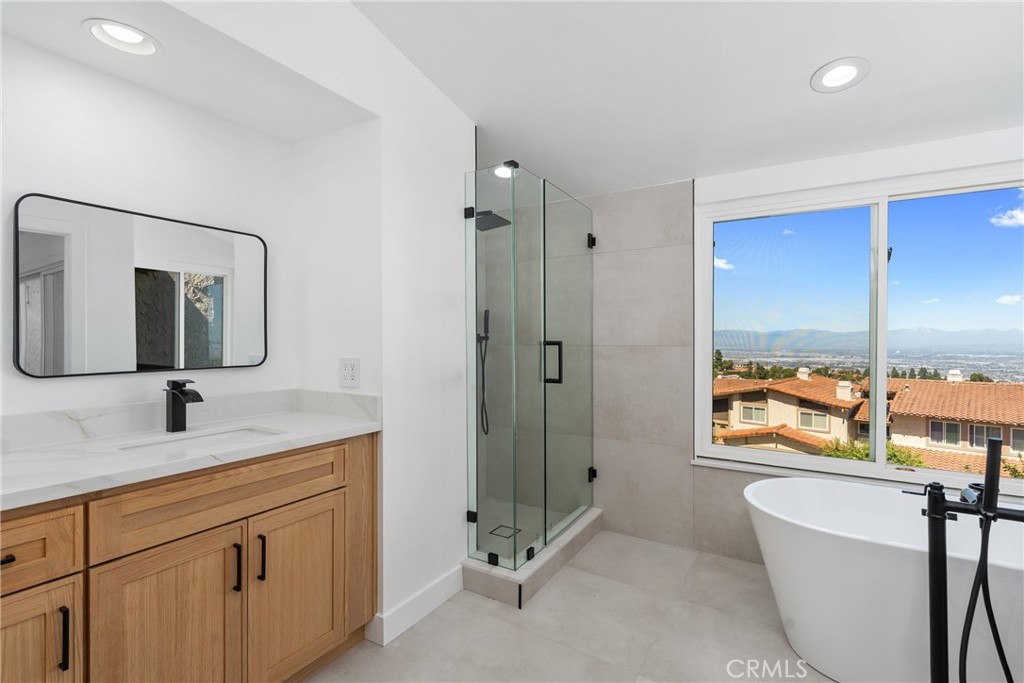 15 Hilltop Circle Rancho Palos Verdes, CA 90275 - Photo 38 of 40 a bathroom with a granite countertop sink mirror and window