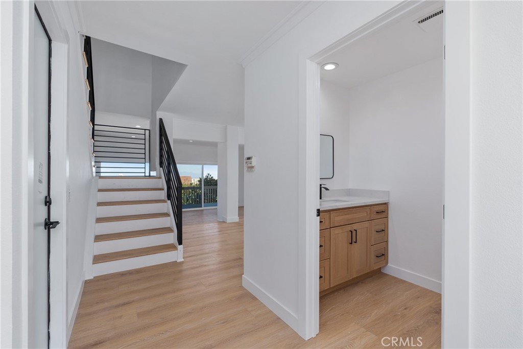 15 Hilltop Circle Rancho Palos Verdes, CA 90275 - Photo 9 of 40 a view of a hallway view with wooden floor and staircase
