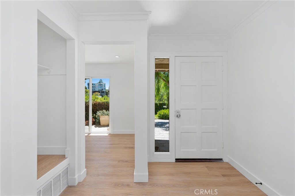 15 Hilltop Circle Rancho Palos Verdes, CA 90275 - Photo 10 of 40 an empty room with wooden floor and windows