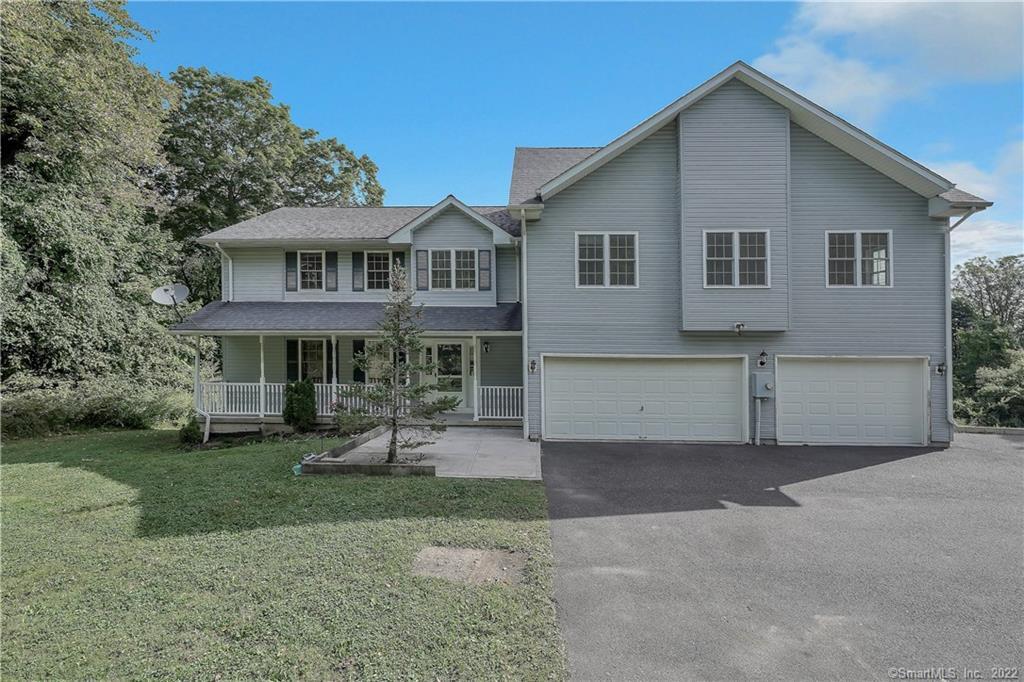 91 A Clapboard Ridge Road Danbury, CT 06811 - Photo 1 of 1 a view of a house with garden