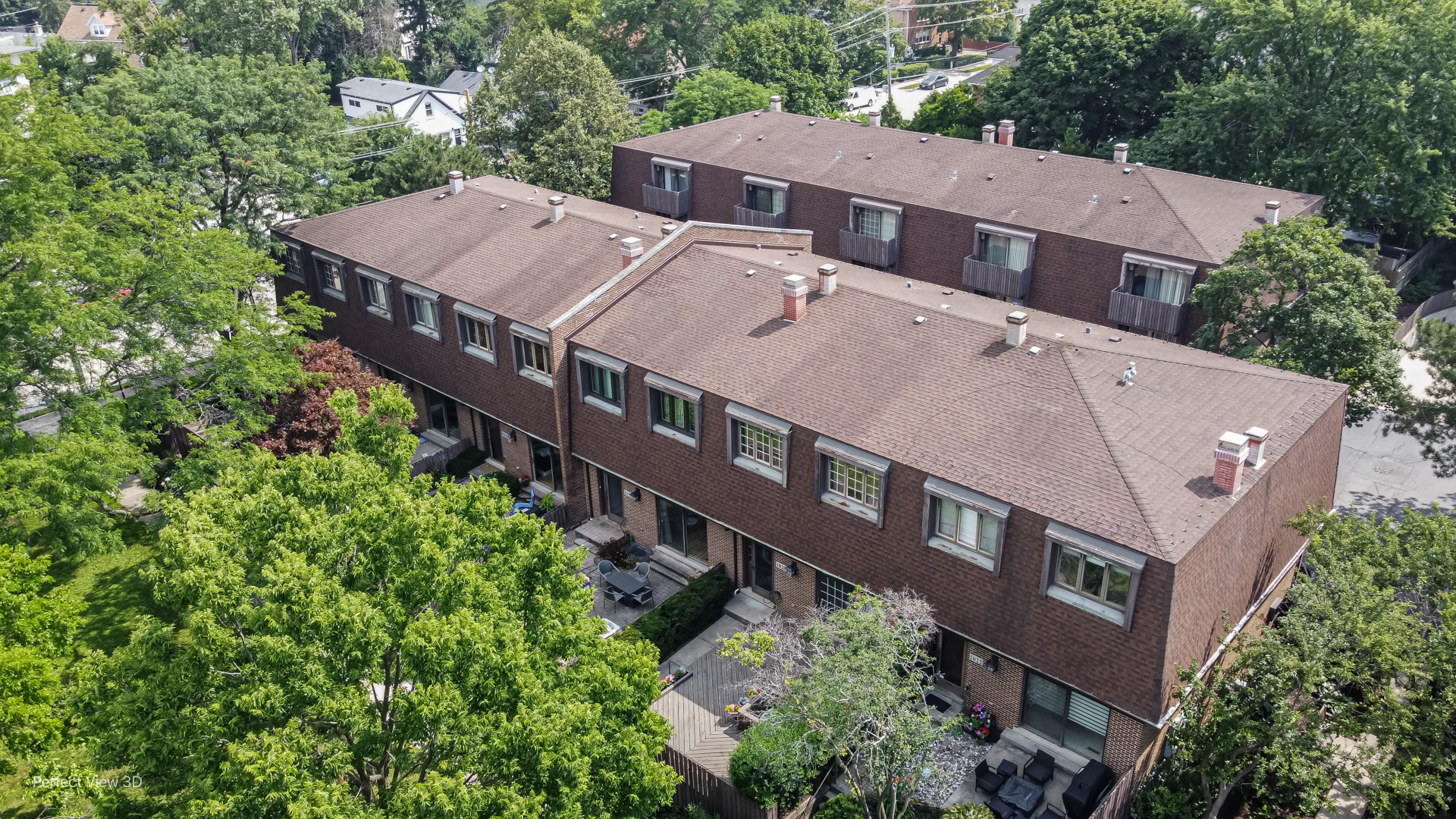 1020 Deerfield Road Highland Park, IL 60035 - Photo 22 of 29 an aerial view of a house with balcony and trees al around