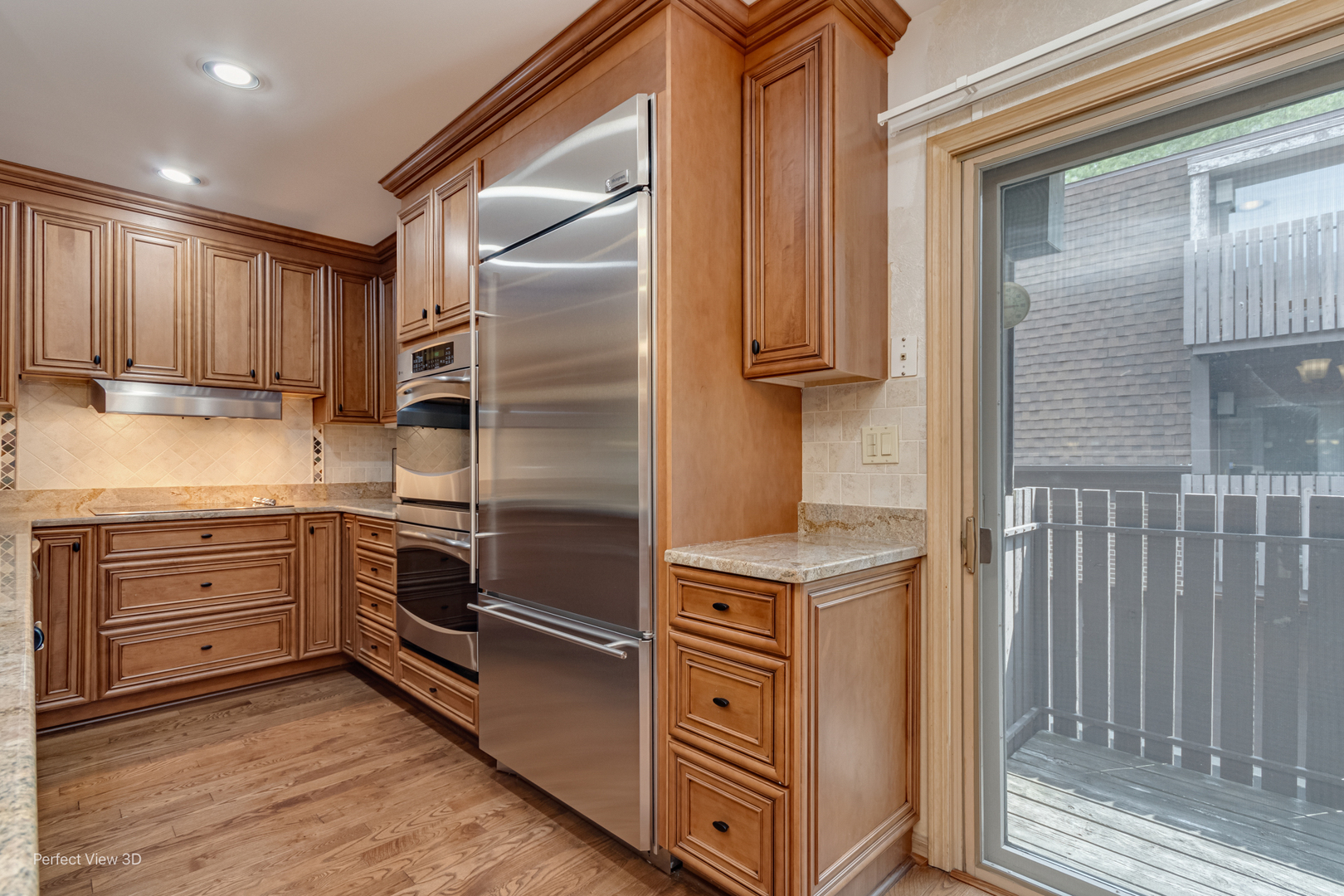 1020 Deerfield Road Highland Park, IL 60035 - Photo 7 of 29 a kitchen with stainless steel appliances granite countertop a stove and a refrigerator