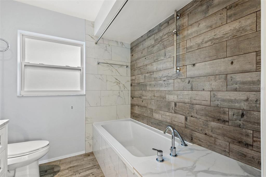 2033 Little Neck Road Clearwater, FL 33755 - Photo 27 of 39 Beautifully remodeled bathroom 2 with shower/tub option