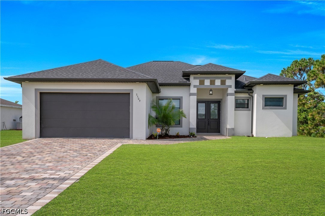 3509 38th Street Southwest Lehigh Acres, FL 33976 - Photo 4 of 47 a front view of a house with a yard and garage