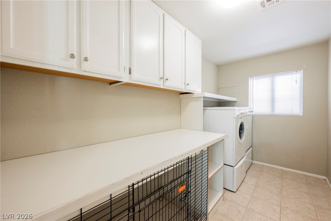 1510 Tree Top Court Henderson, NV 89014 - Photo 32 of 97 Downstairs Laundry Room with Built-in Cabinets and Dog Kennel
