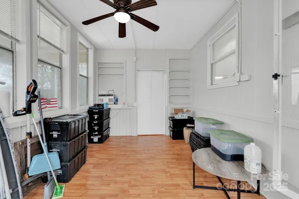 a bedroom with furniture and a window