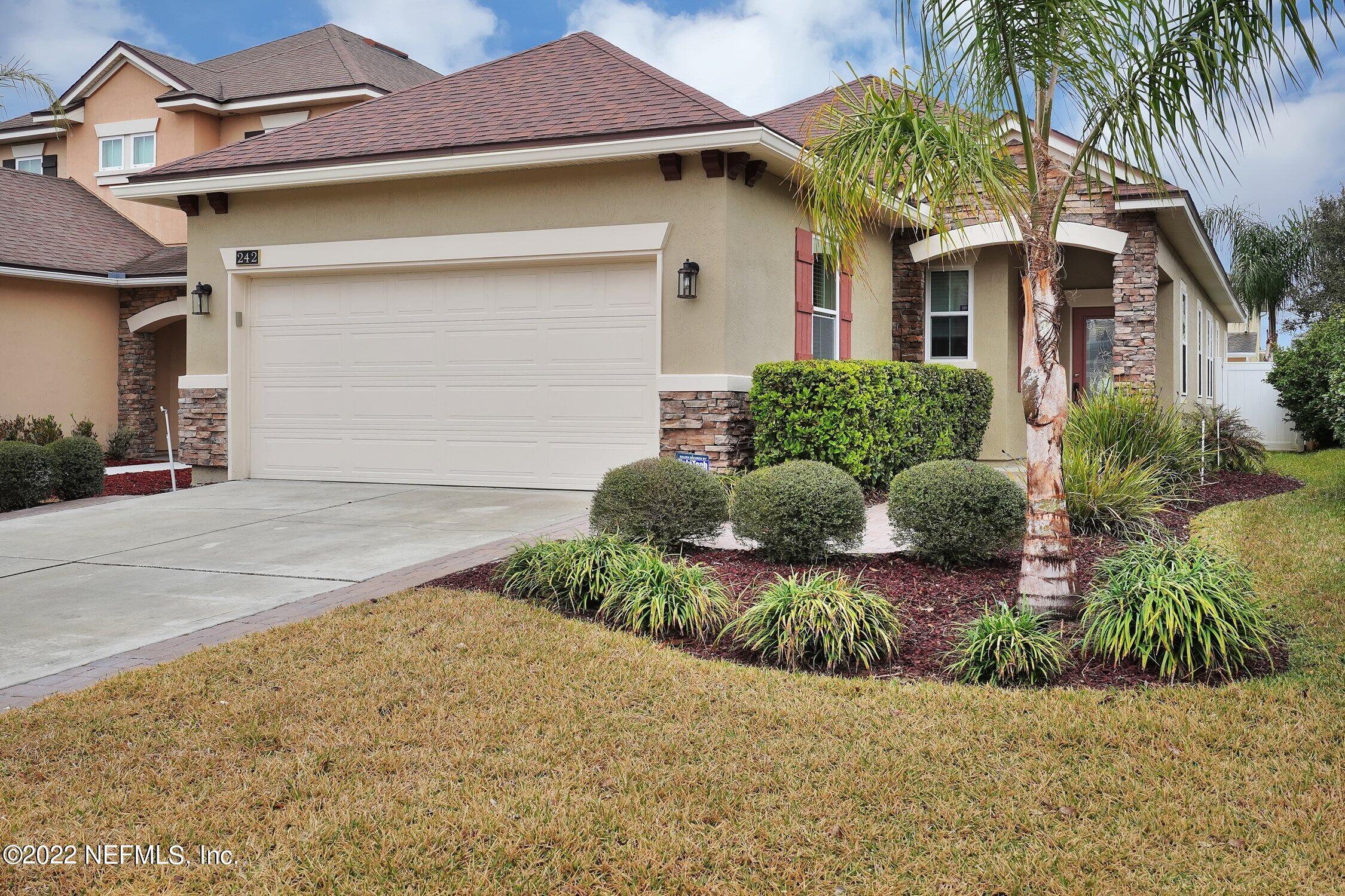242 Taylor Ridge Avenue Ponte Vedra, FL 32081 - Photo 1 of 26 a front view of a house with a yard