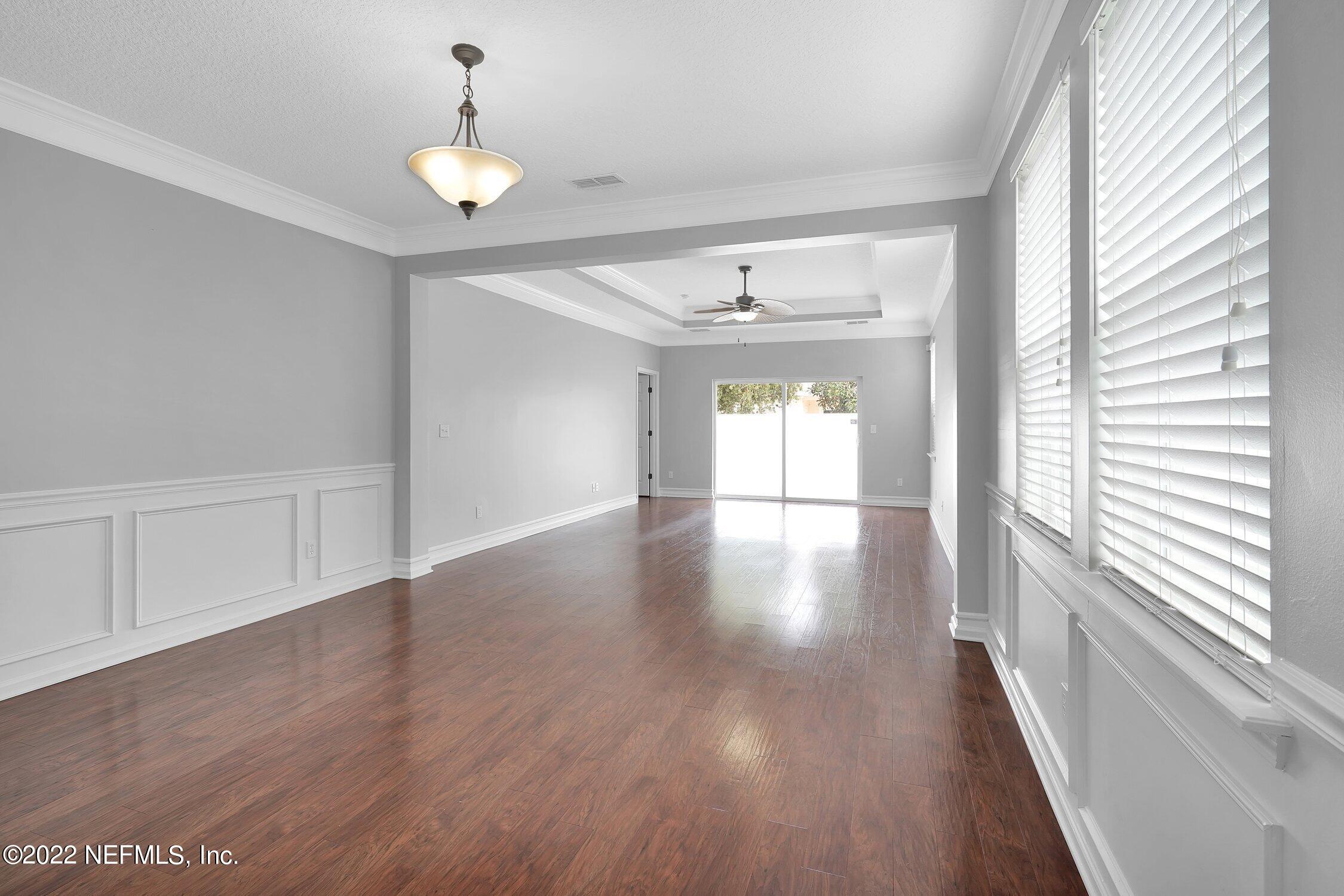242 Taylor Ridge Avenue Ponte Vedra, FL 32081 - Photo 14 of 26 a view of an empty room with wooden floor and a window