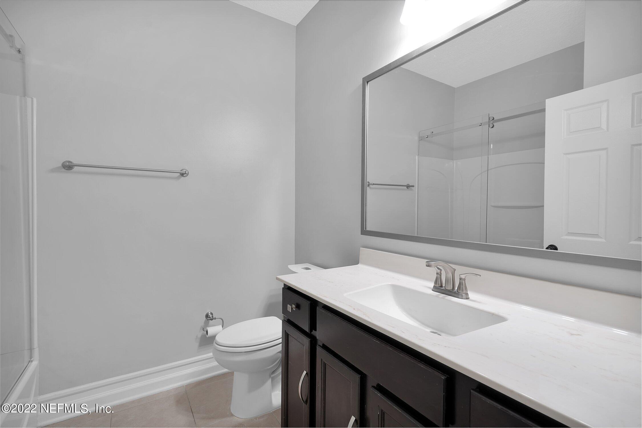 242 Taylor Ridge Avenue Ponte Vedra, FL 32081 - Photo 16 of 26 a bathroom with a sink toilet and vanity