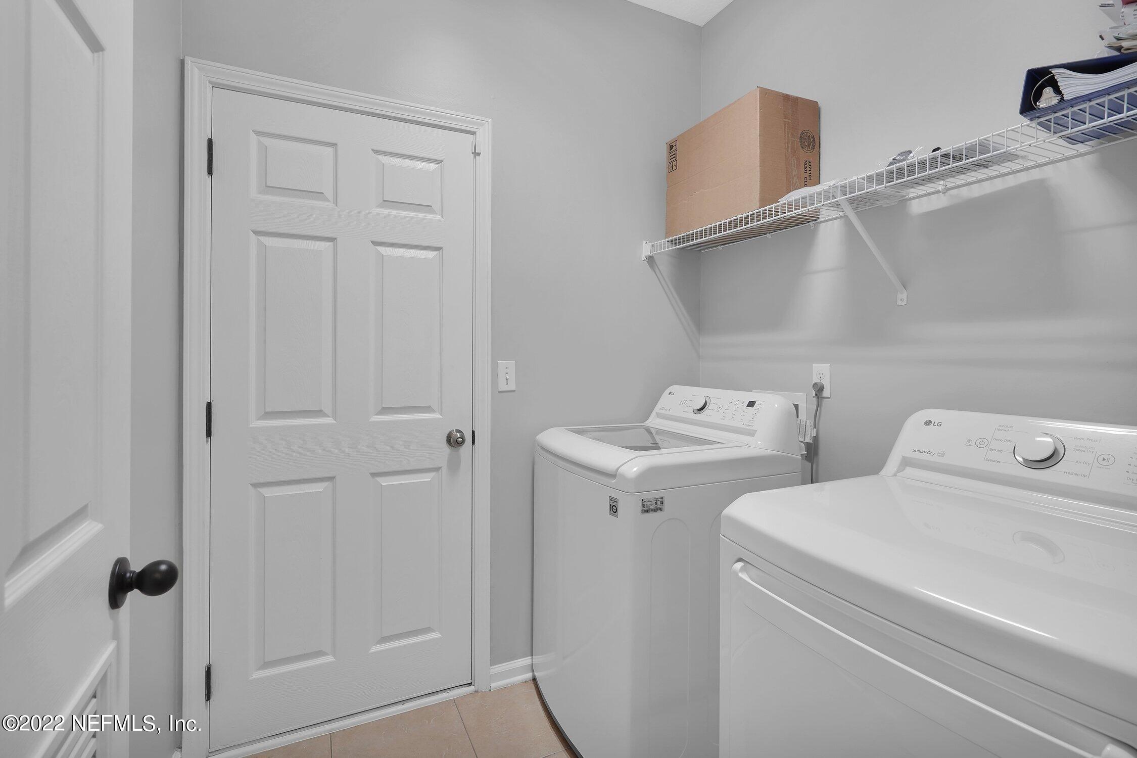 242 Taylor Ridge Avenue Ponte Vedra, FL 32081 - Photo 17 of 26 a utility room with dryer and washer