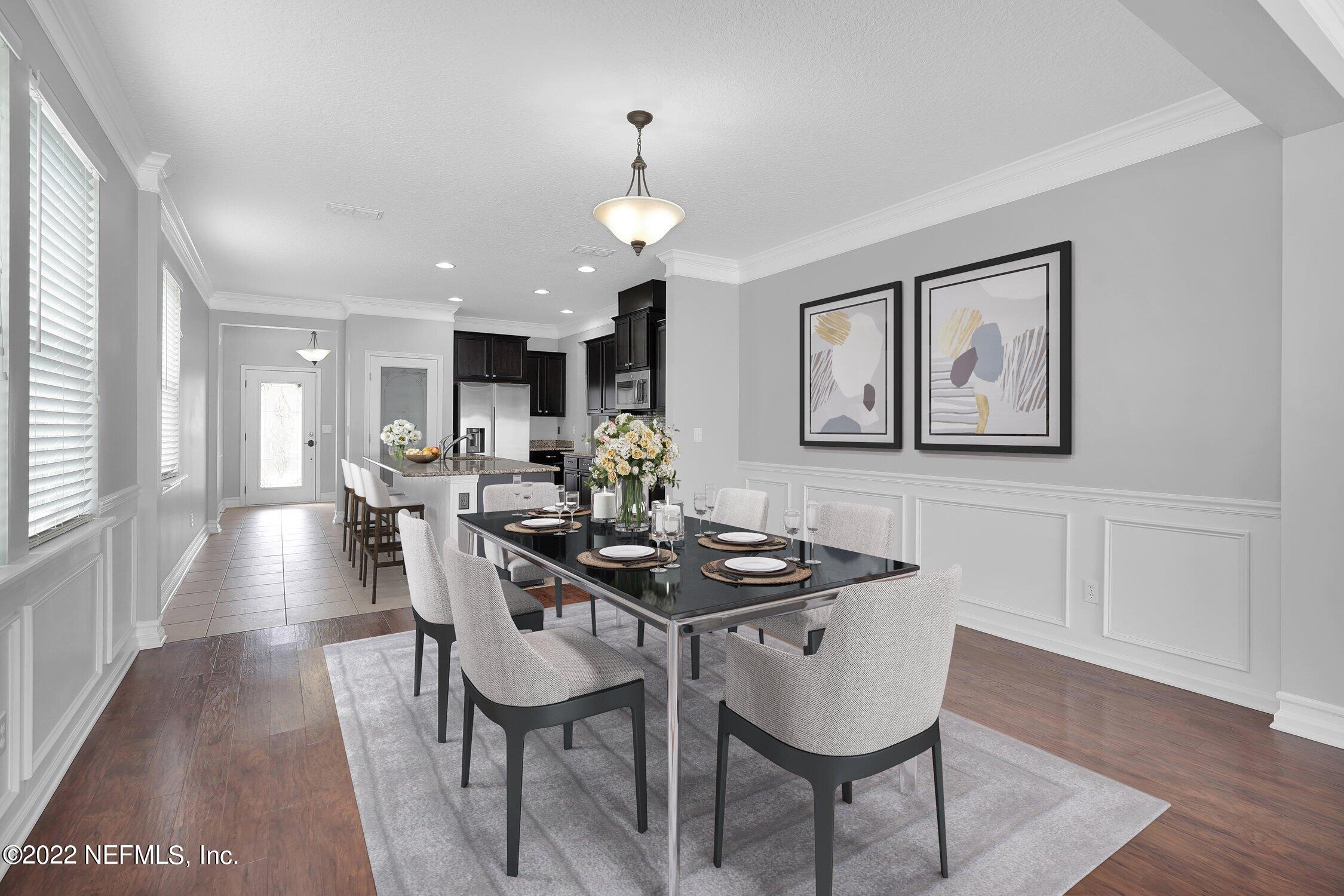 242 Taylor Ridge Avenue Ponte Vedra, FL 32081 - Photo 3 of 26 a view of a a dining room with furniture window and wooden floor