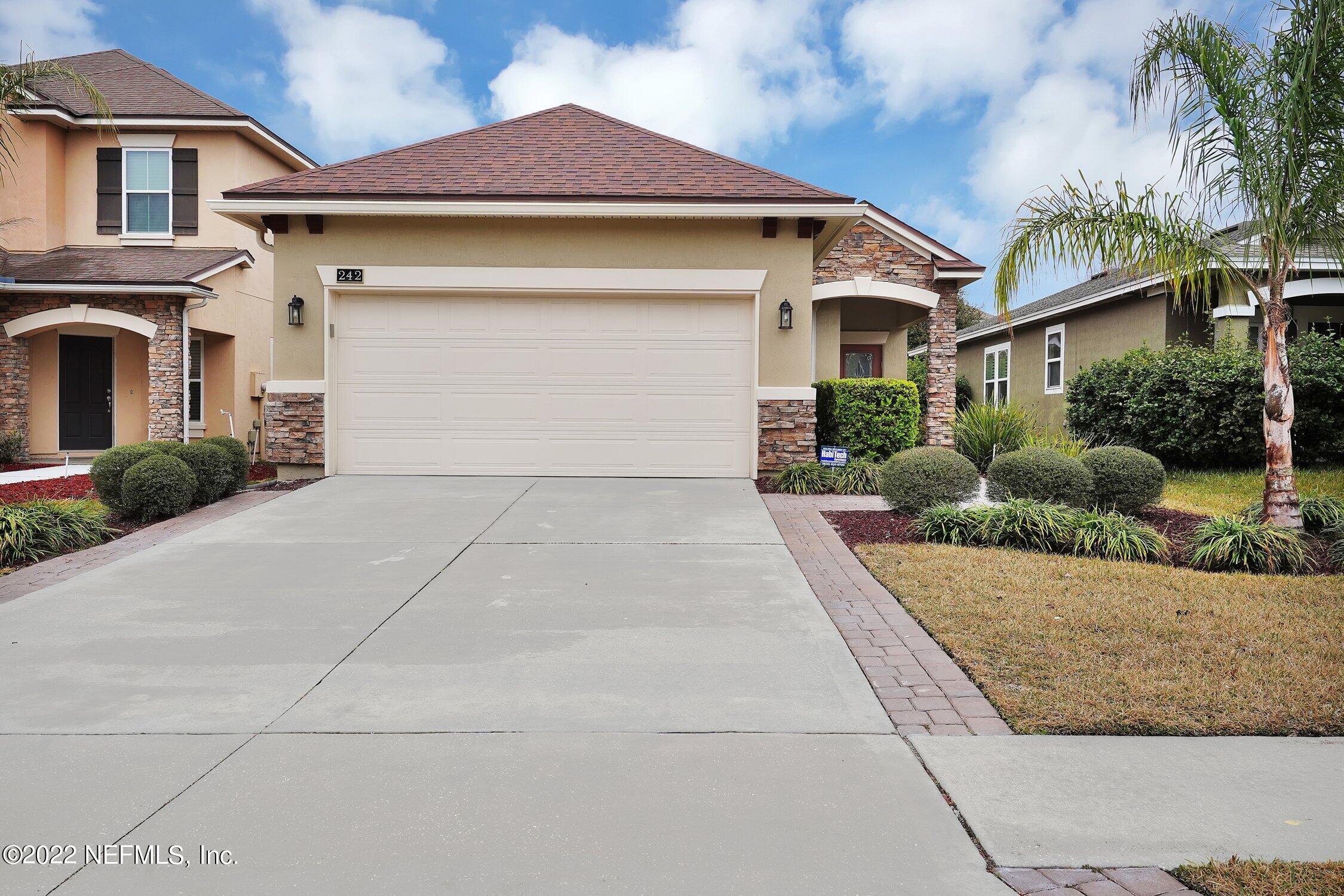 242 Taylor Ridge Avenue Ponte Vedra, FL 32081 - Photo 9 of 26 a front view of a house with garden
