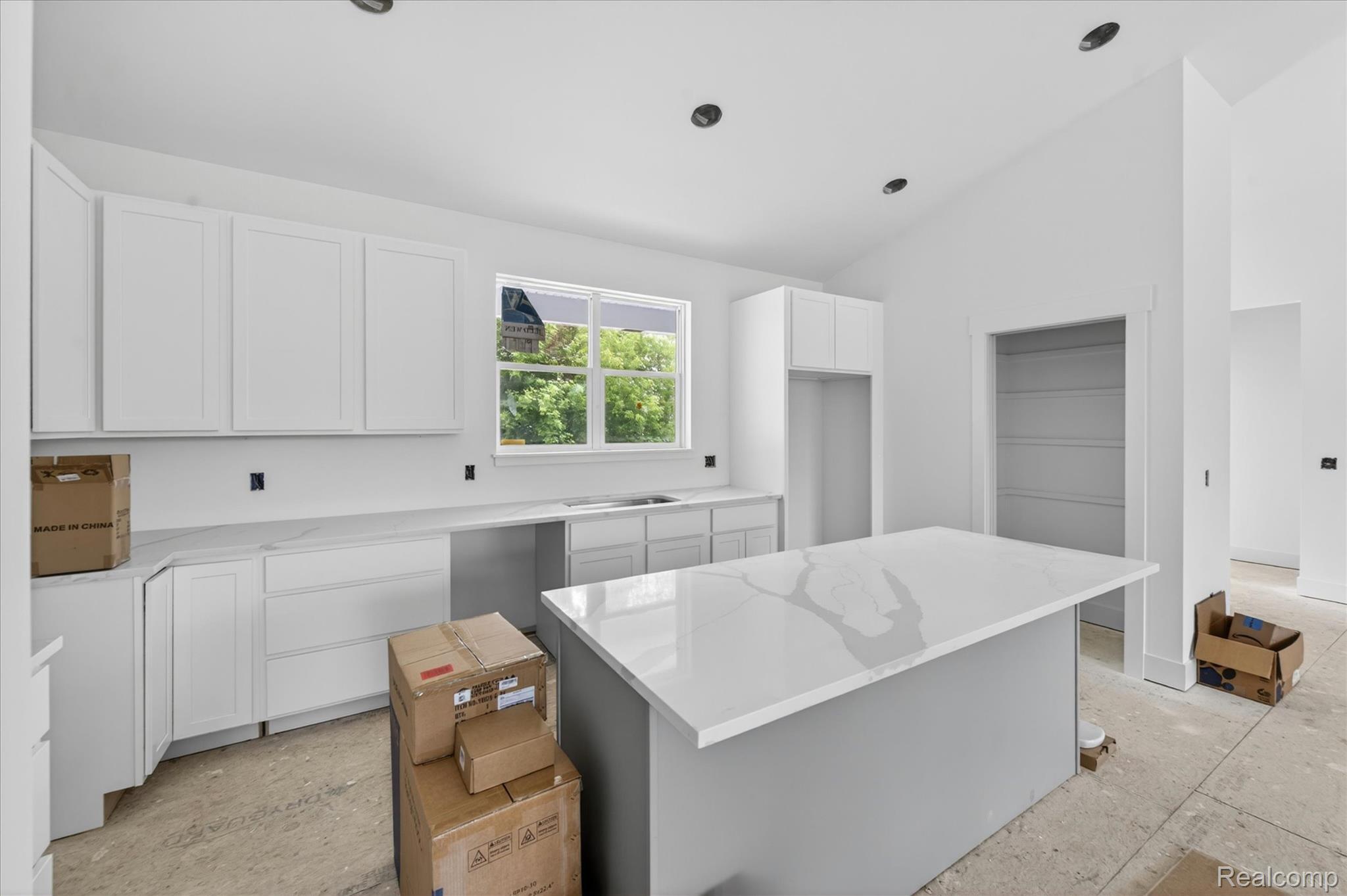 3297 Oak Grove Road Howell, MI 48855 - Photo 8 of 40 Open kitchen design with ample cabinet space and seamless flow into the living area.