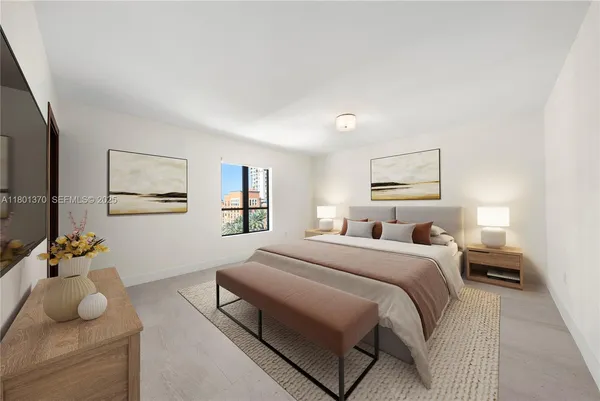 a bedroom with a bed and a couch