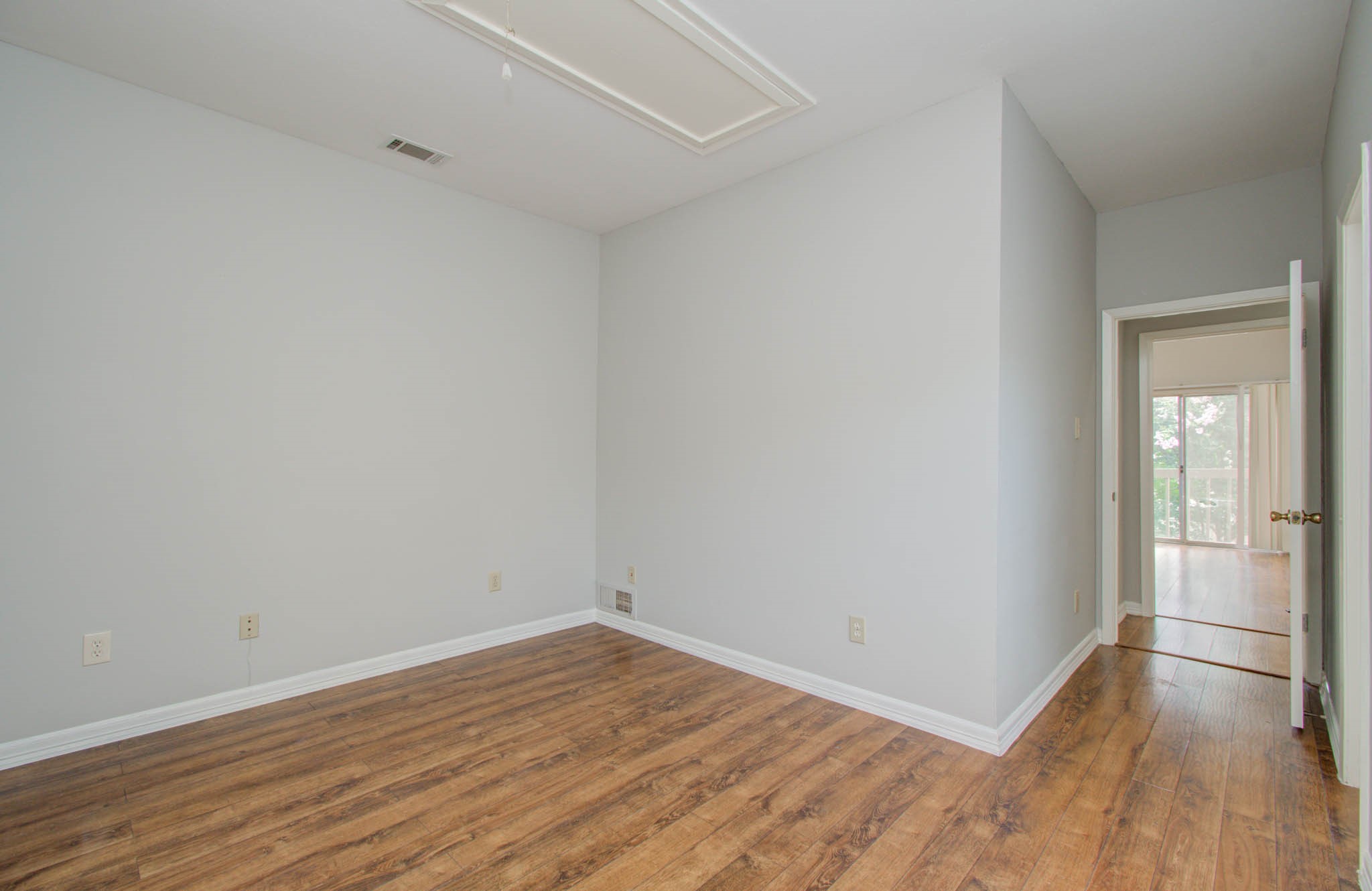 12697 Briar Patch Drive, Unit 2 Houston, TX 77077 - Photo 15 of 24 a view of a room with wooden floor