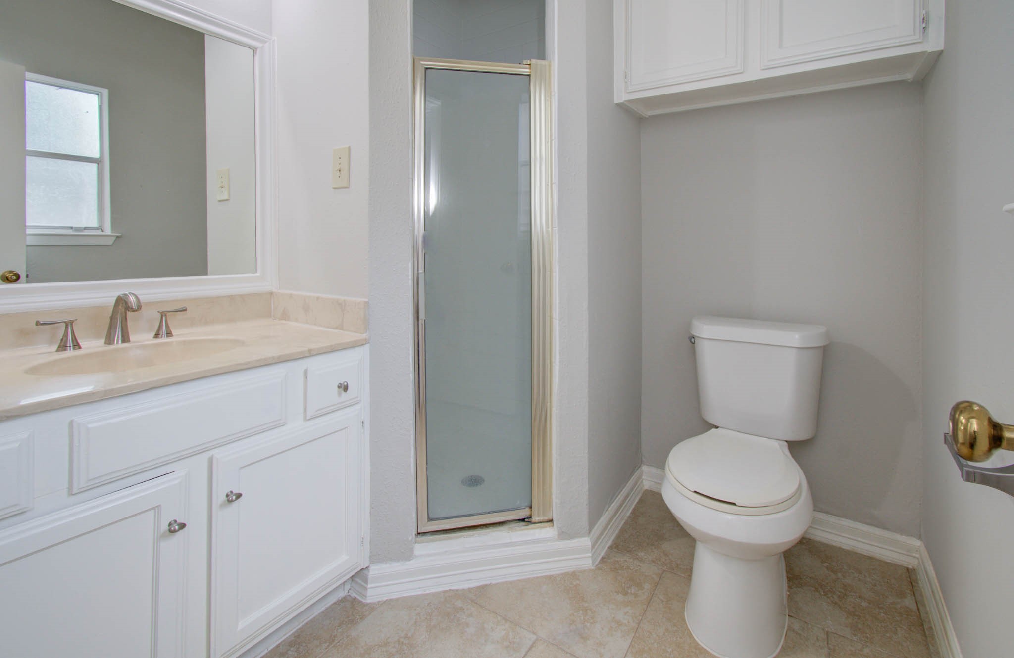 12697 Briar Patch Drive, Unit 2 Houston, TX 77077 - Photo 17 of 24 a bathroom with a toilet sink and mirror