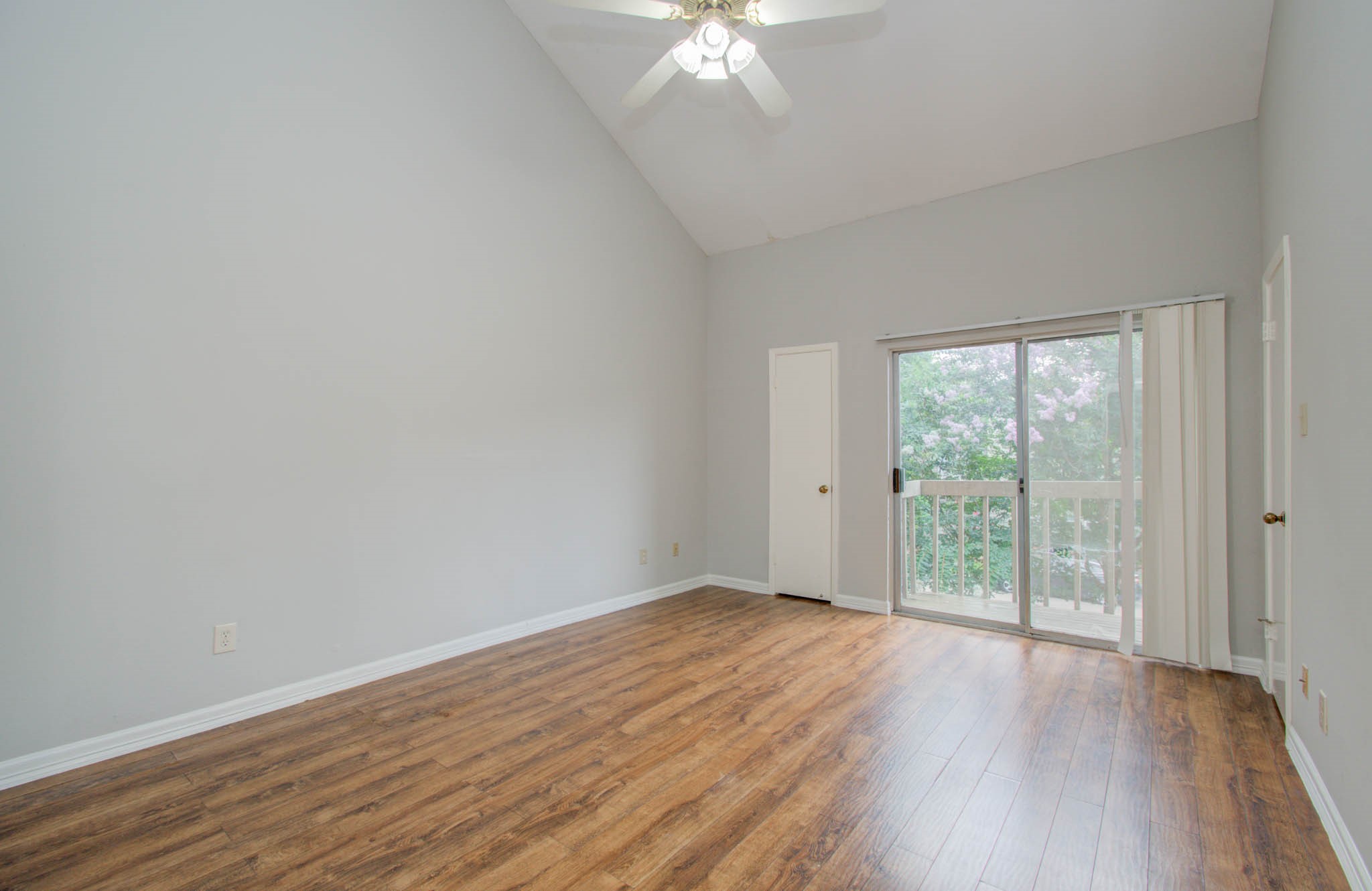 12697 Briar Patch Drive, Unit 2 Houston, TX 77077 - Photo 18 of 24 wooden floor in an empty room with a window