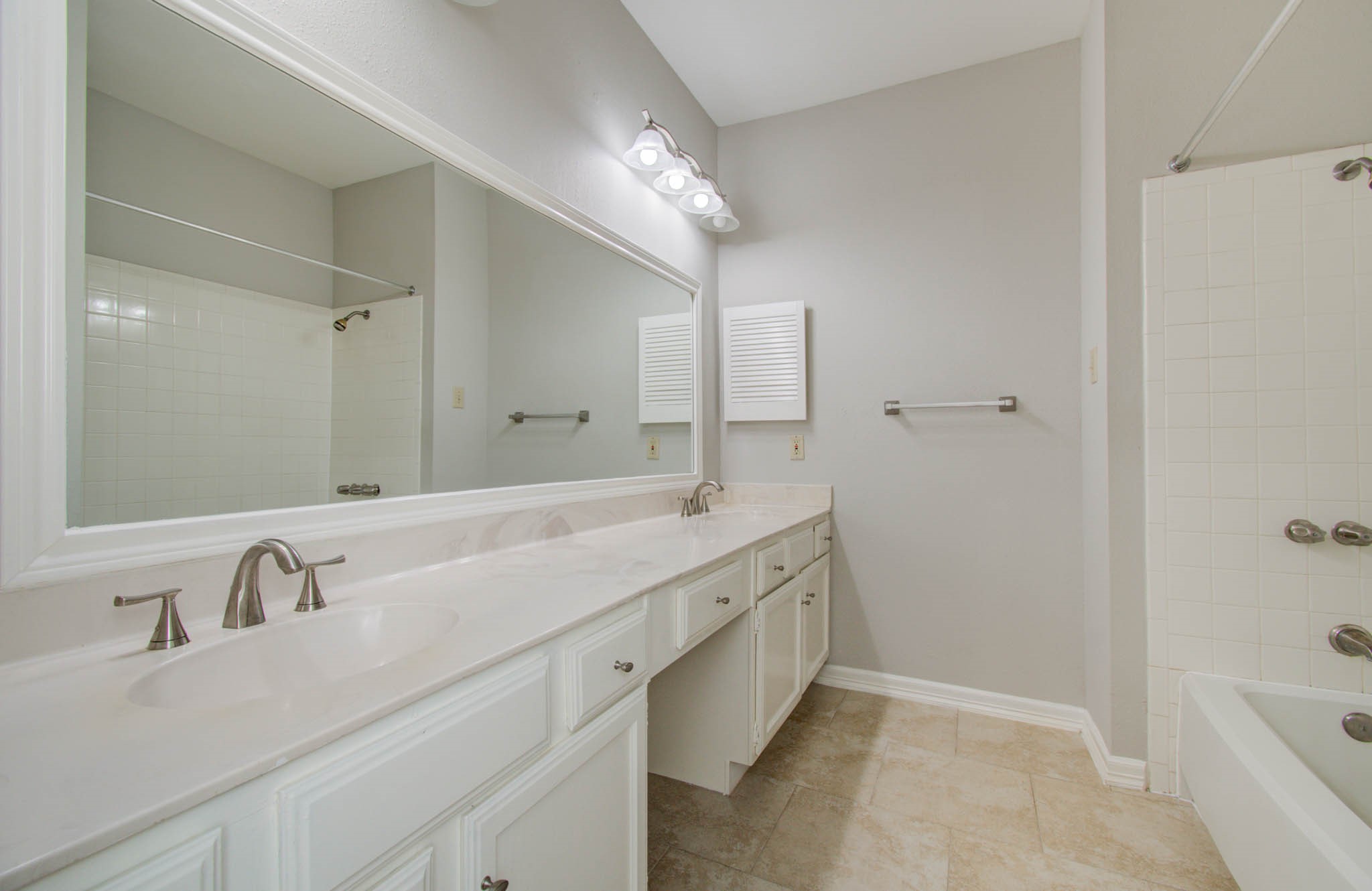 12697 Briar Patch Drive, Unit 2 Houston, TX 77077 - Photo 22 of 24 a bathroom with a tub sink double and mirror