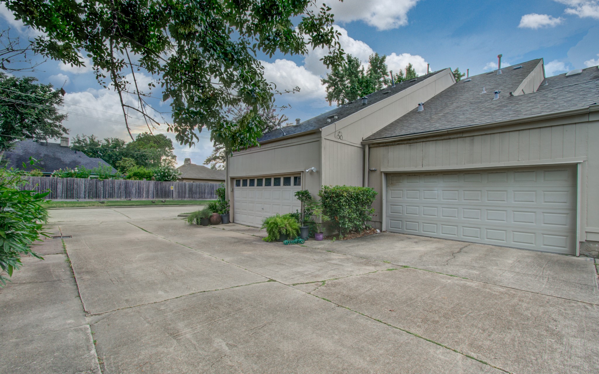 12697 Briar Patch Drive, Unit 2 Houston, TX 77077 - Photo 24 of 24 a front view of a house with garage