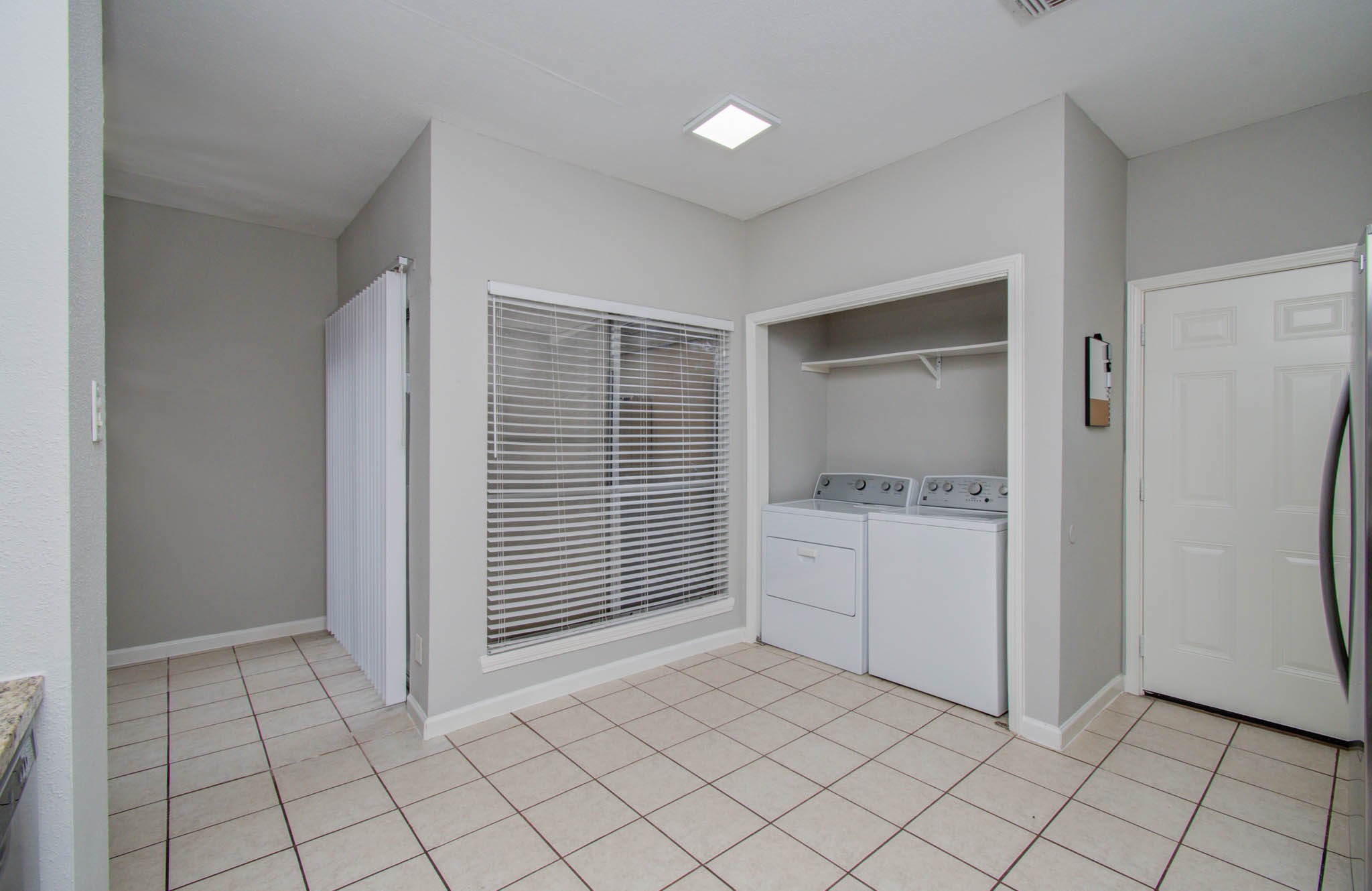 12697 Briar Patch Drive, Unit 2 Houston, TX 77077 - Photo 10 of 24 a room view with a wooden floor and white doors