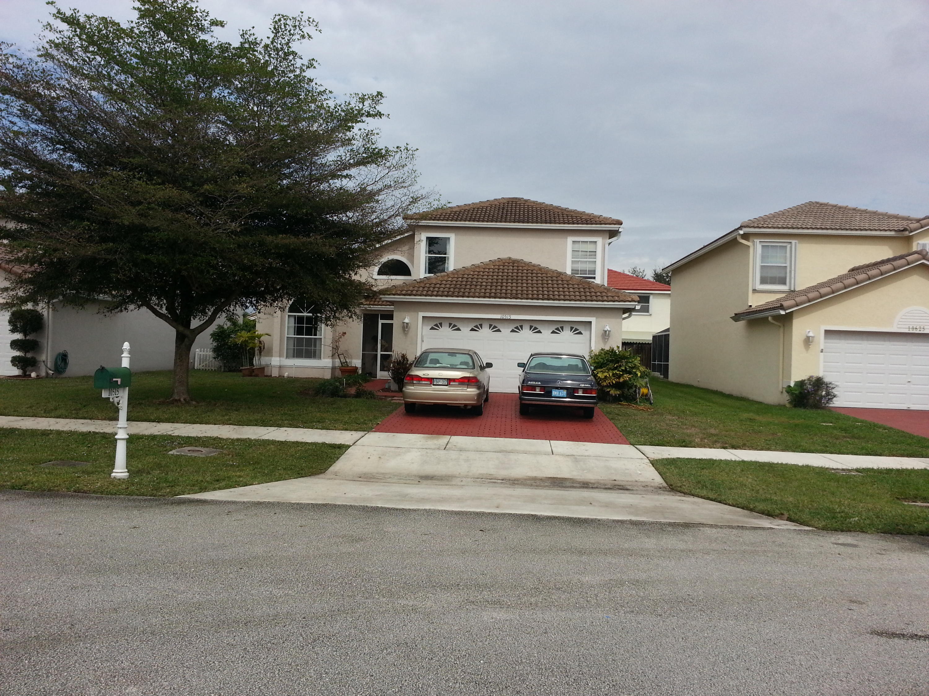 10515 Plainview Circle Boca Raton, FL 33498 - Photo 1 of 33 a front view of a house with a yard