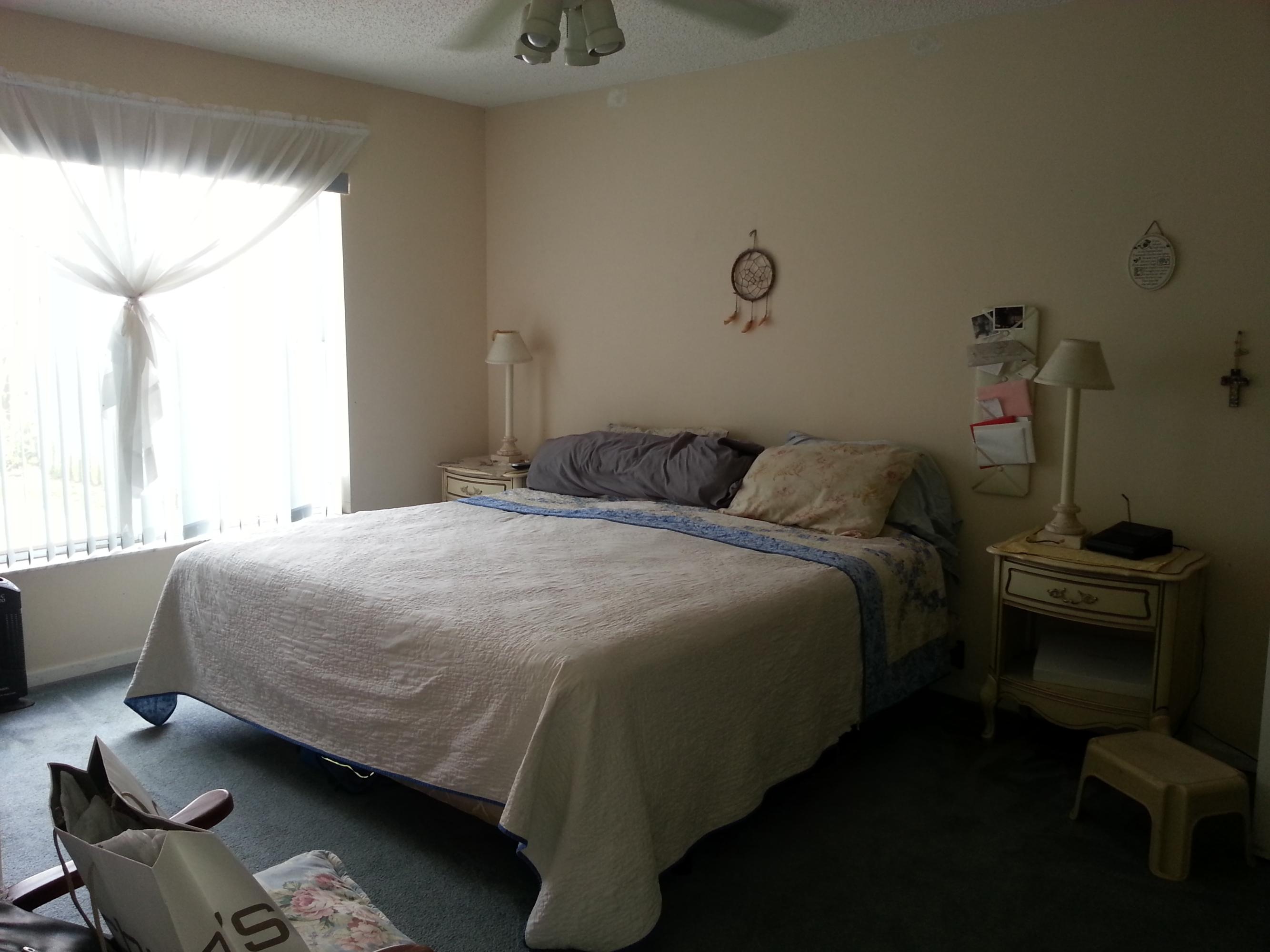 10515 Plainview Circle Boca Raton, FL 33498 - Photo 7 of 33 a bedroom with a bed and a chair