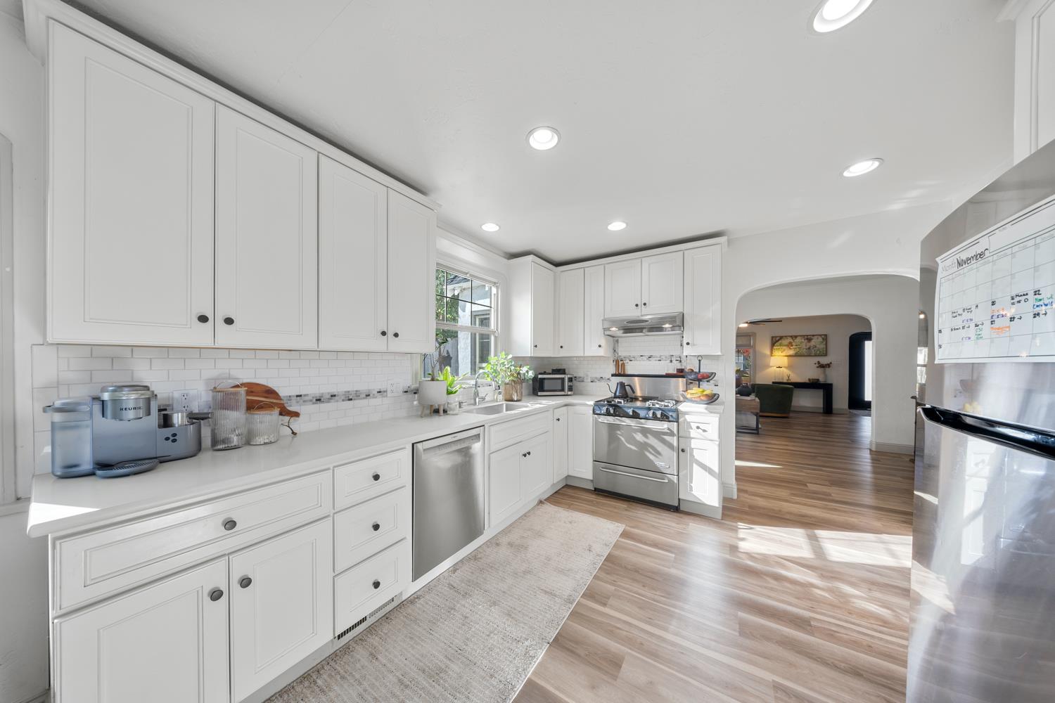 530 Myrtle Avenue Modesto, CA 95350 - Photo 18 of 29 a kitchen with granite countertop white cabinets and white appliances
