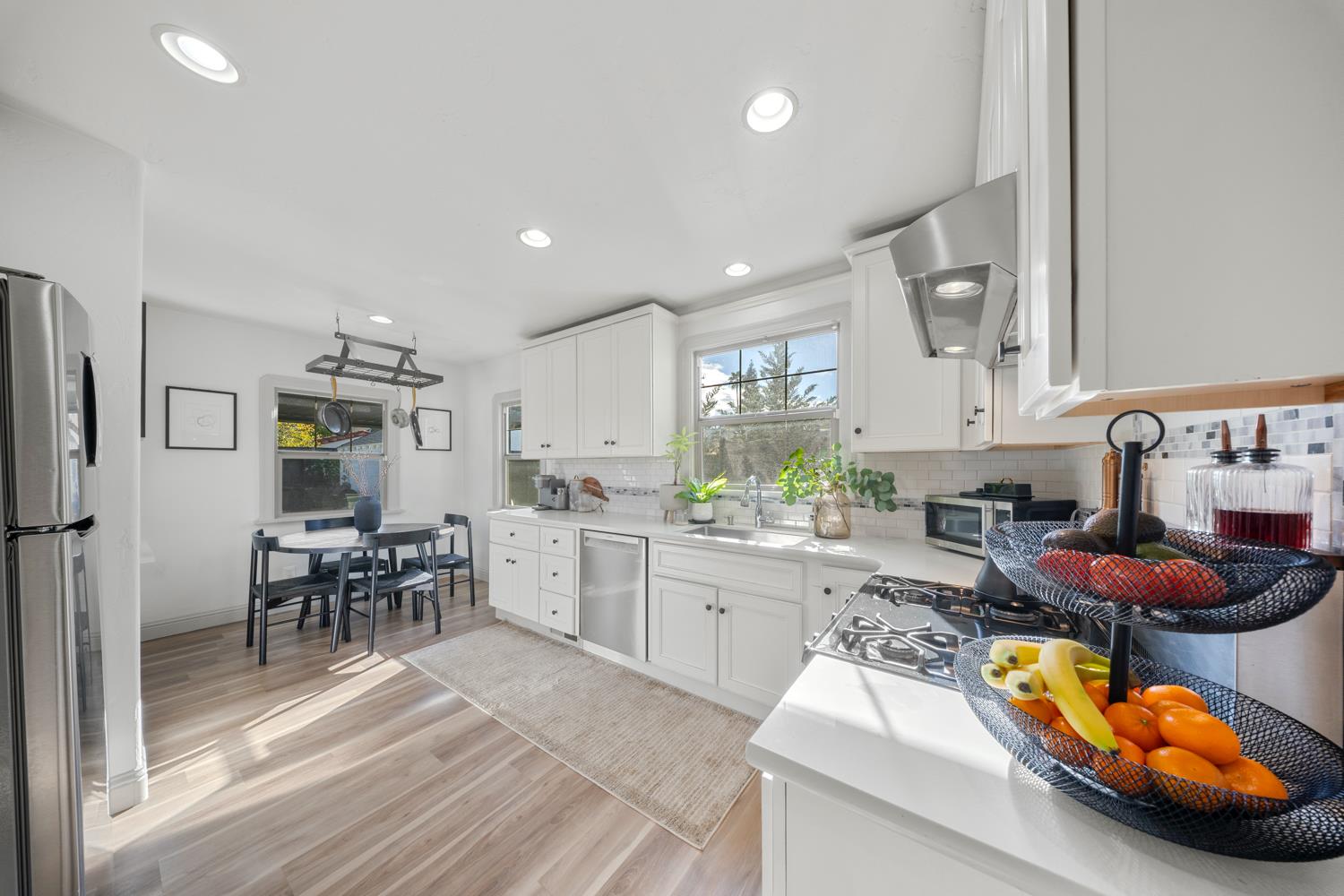 530 Myrtle Avenue Modesto, CA 95350 - Photo 4 of 29 a kitchen with furniture and a wooden floors