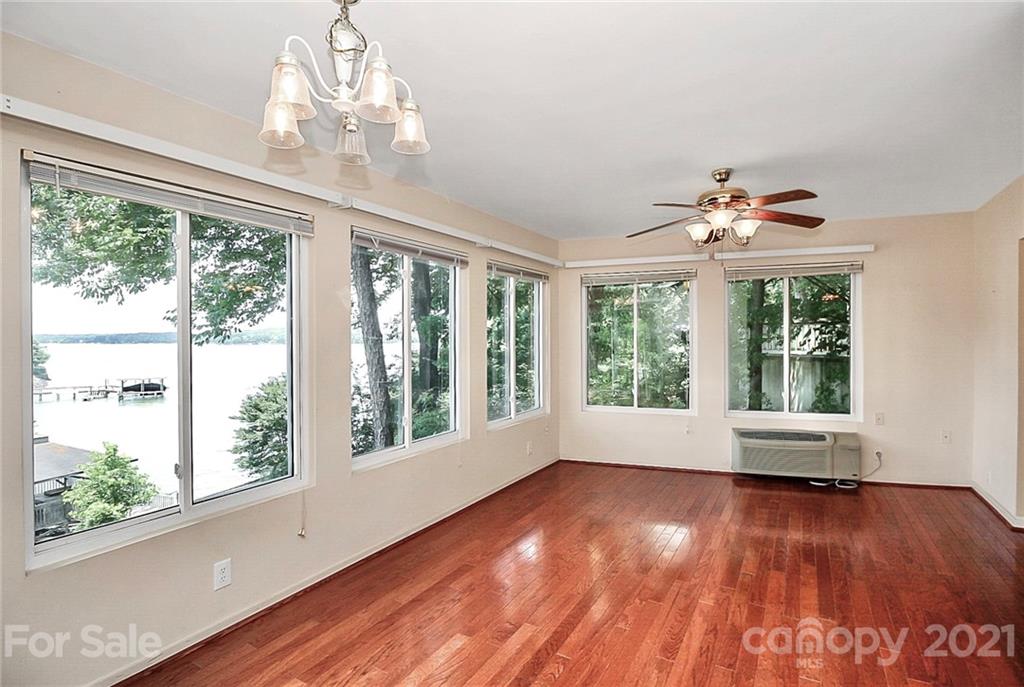7017 Chelsea Day Lane Tega Cay, SC 29708 - Photo 15 of 48 a view of empty room with wooden floor and fan