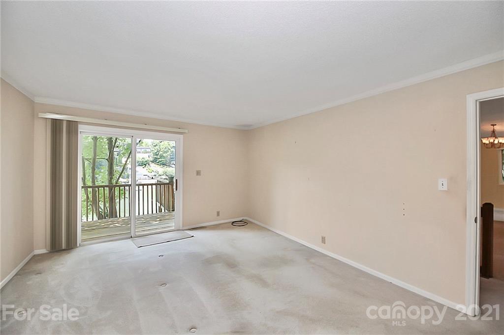 7017 Chelsea Day Lane Tega Cay, SC 29708 - Photo 17 of 48 a view of an empty room with a window