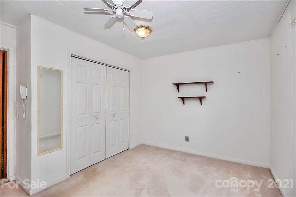 7017 Chelsea Day Lane Tega Cay, SC 29708 - Photo 22 of 48 a view of a hallway with a ceiling fan