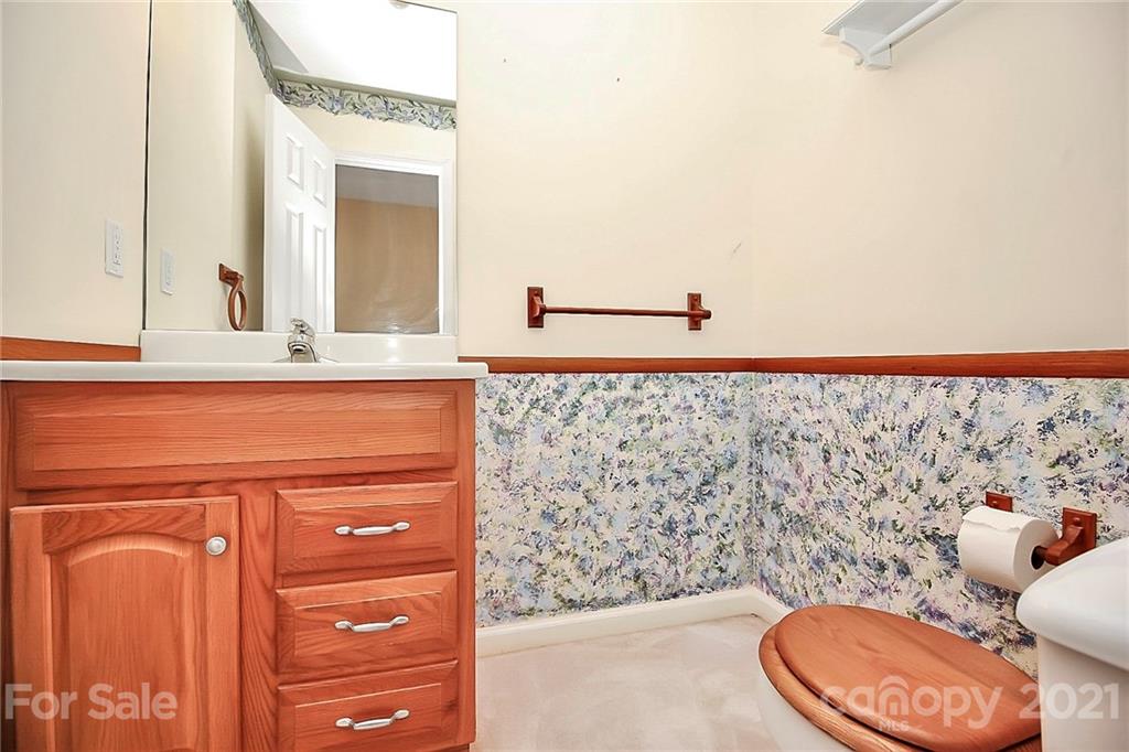 7017 Chelsea Day Lane Tega Cay, SC 29708 - Photo 23 of 48 a bathroom with a toilet sink and mirror
