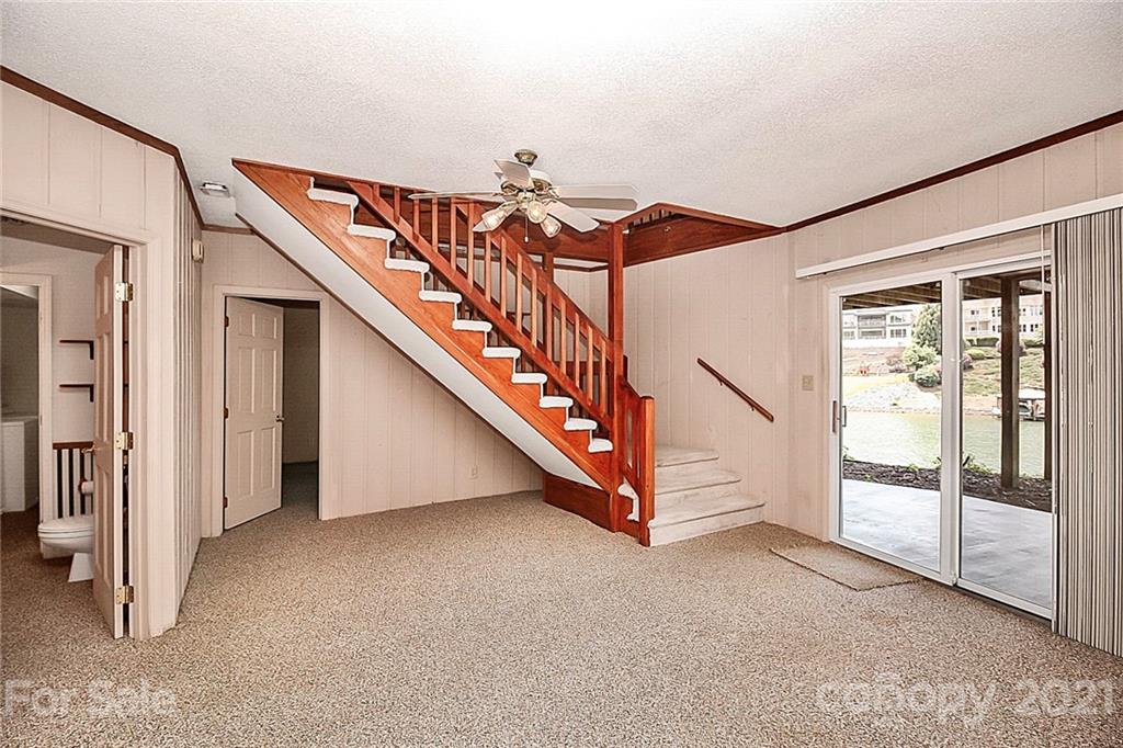 7017 Chelsea Day Lane Tega Cay, SC 29708 - Photo 24 of 48 a view of a hallway with staircase