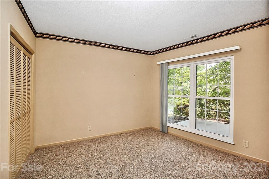 7017 Chelsea Day Lane Tega Cay, SC 29708 - Photo 27 of 48 a view of an empty room with a window