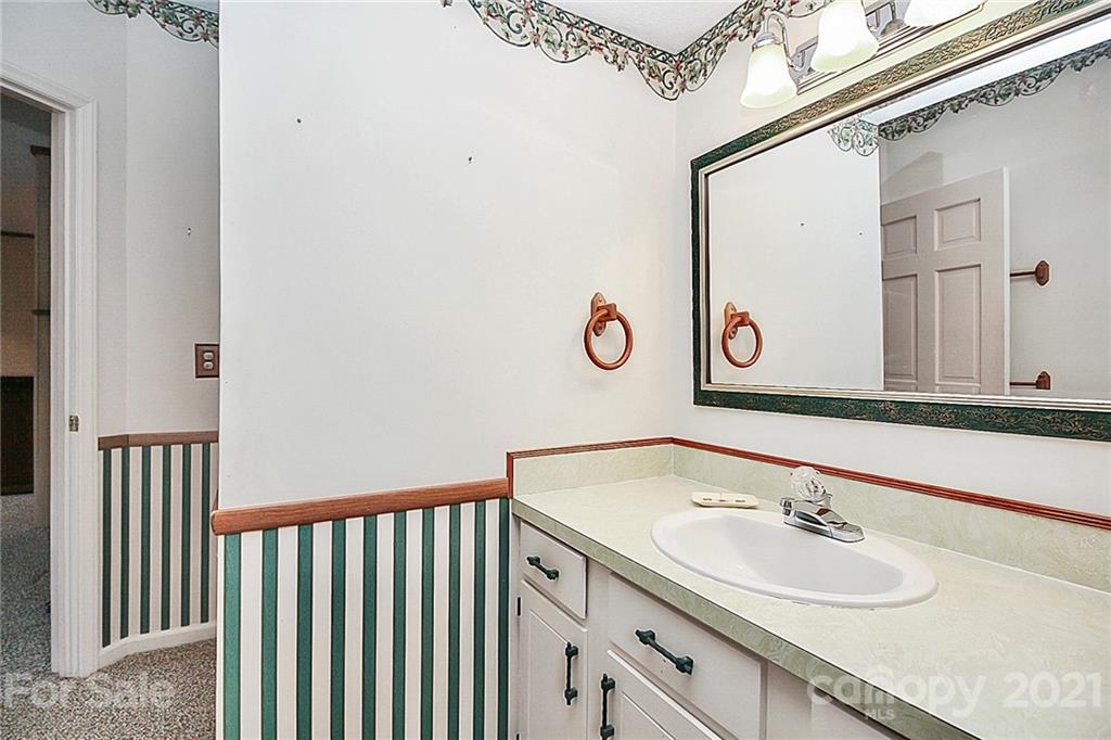7017 Chelsea Day Lane Tega Cay, SC 29708 - Photo 29 of 48 a bathroom with a sink and a mirror