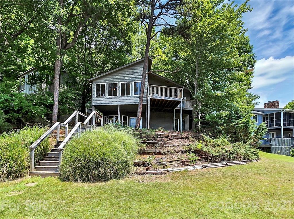 7017 Chelsea Day Lane Tega Cay, SC 29708 - Photo 35 of 48 a front view of a house with a yard