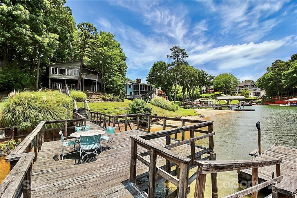 7017 Chelsea Day Lane Tega Cay, SC 29708 - Photo 38 of 48 a view of a lake with a table and chairs