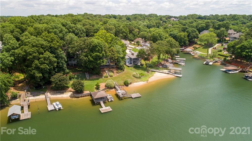 7017 Chelsea Day Lane Tega Cay, SC 29708 - Photo 43 of 48 a view of a lake with houses