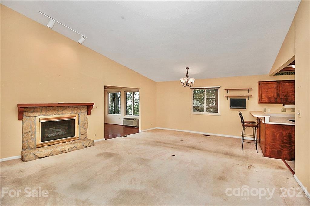 7017 Chelsea Day Lane Tega Cay, SC 29708 - Photo 8 of 48 a view of livingroom with furniture fireplace and window