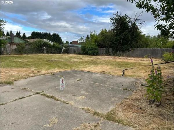 a view of a swimming pool with a yard