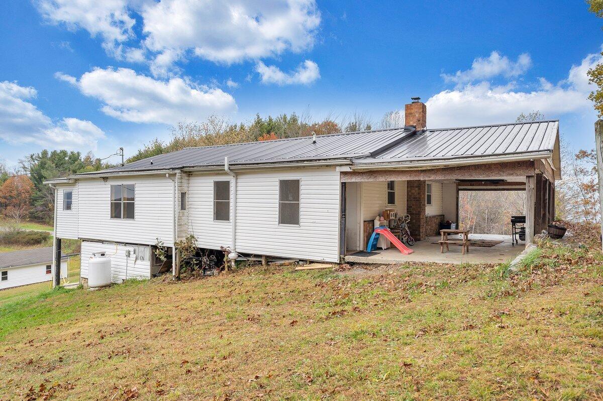 446 Macks Mountain Road Northwest Indian Valley, VA 24105 - Photo 18 of 59 a view of a house with backyard and porch
