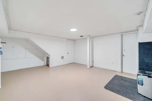 a bed room with a bed and a tv