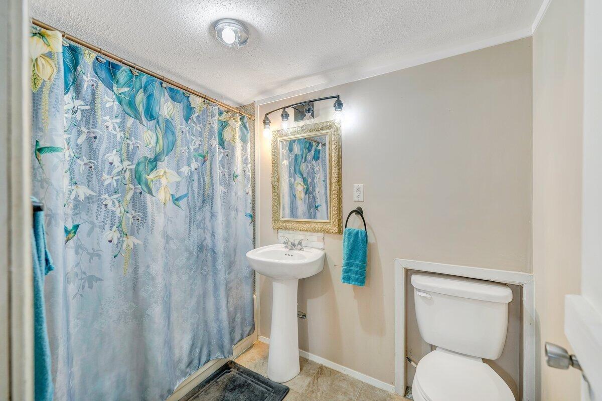 446 Macks Mountain Road Northwest Indian Valley, VA 24105 - Photo 27 of 59 a bathroom with a sink toilet and shower