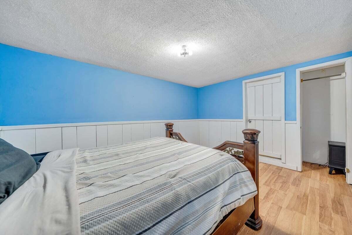 446 Macks Mountain Road Northwest Indian Valley, VA 24105 - Photo 28 of 59 a bed room with a bed and a tv