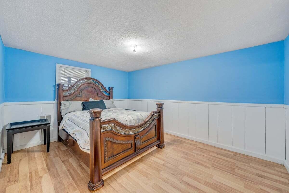 446 Macks Mountain Road Northwest Indian Valley, VA 24105 - Photo 30 of 59 a bed room with a bed and a painting on the wall