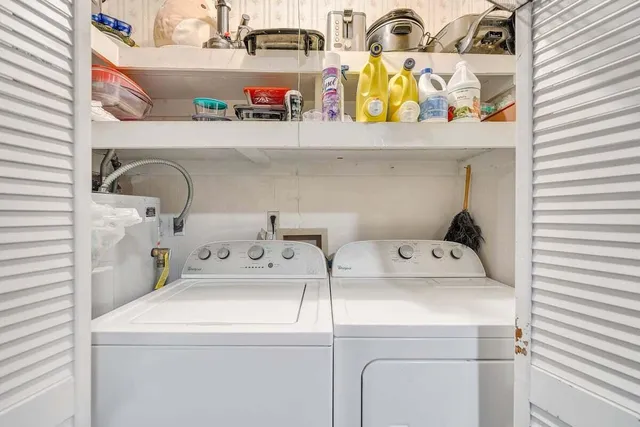 a bedroom with a bed and a table in it