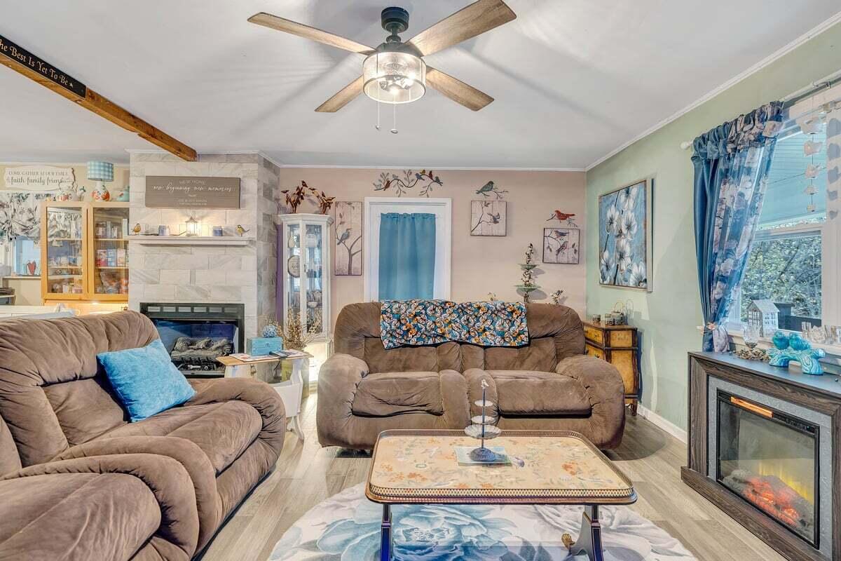 446 Macks Mountain Road Northwest Indian Valley, VA 24105 - Photo 53 of 59 a living room with furniture a fireplace and a chandelier