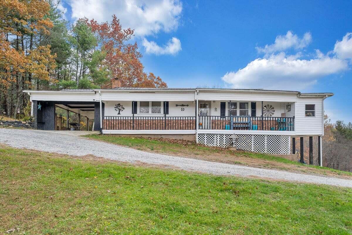 446 Macks Mountain Road Northwest Indian Valley, VA 24105 - Photo 58 of 59 a view of house with a swimming pool