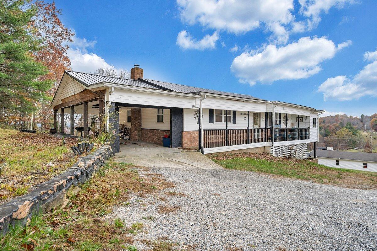 446 Macks Mountain Road Northwest Indian Valley, VA 24105 - Photo 10 of 59 a view of a house with a yard and large tree