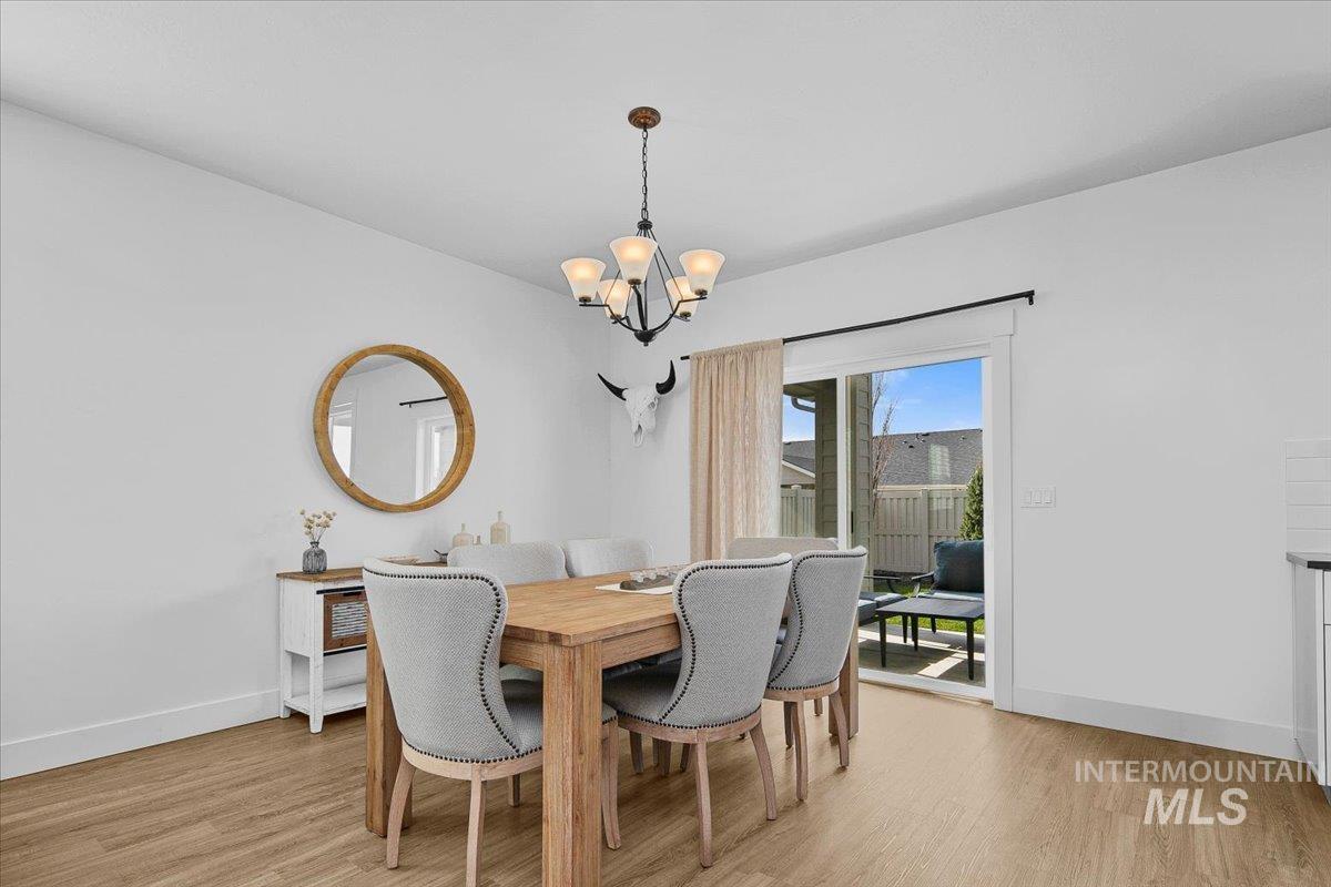 2085 North Concha Court Middleton, ID 83644 - Photo 15 of 37 Dining space featuring a chandelier and light wood-style floors